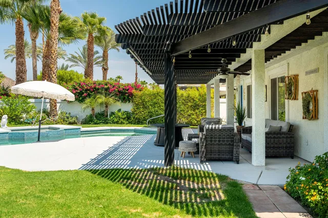 a patio with a table and chairs