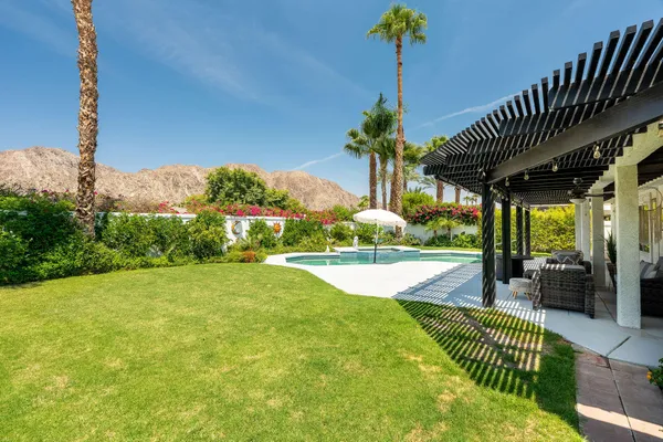 a view of a swimming pool with a patio