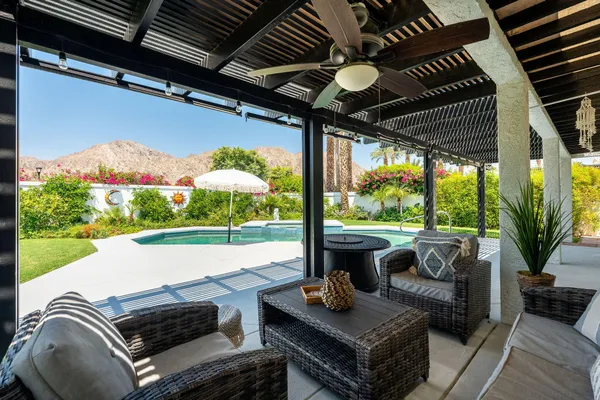 a outdoor living space with furniture and garden view