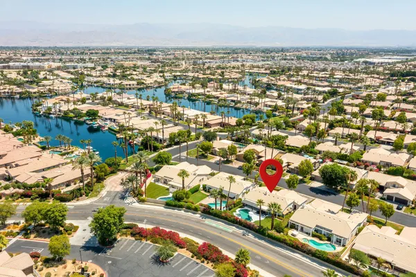 an aerial view of residential building and lake
