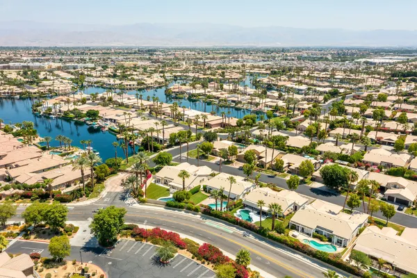 an aerial view of residential building and car parked