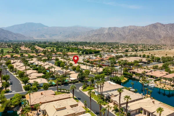 an aerial view of residential houses and outdoor space