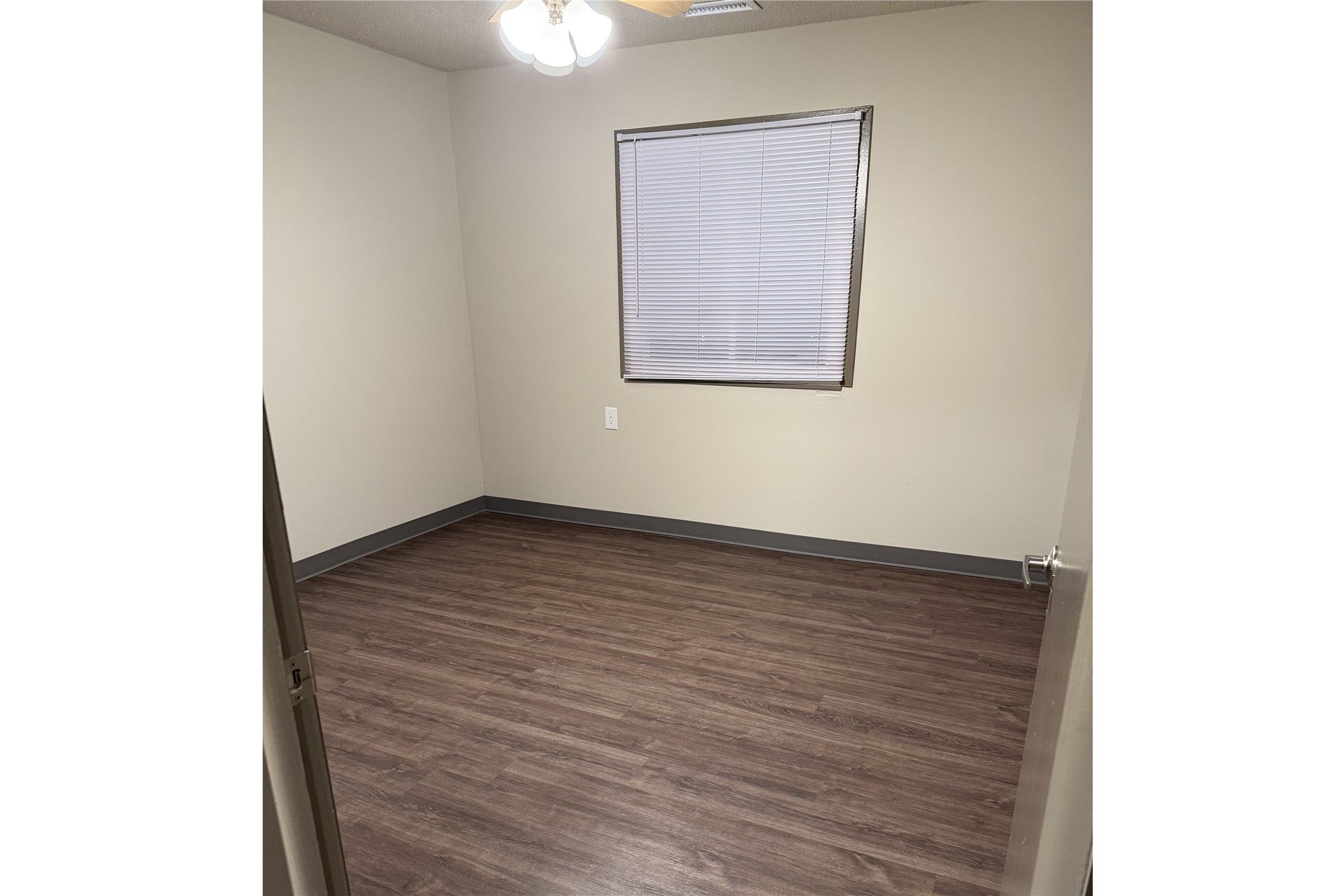 1700 Park Street Beatrice, NE 68310 - Photo 11 of 13 a view of an empty room with wooden floor