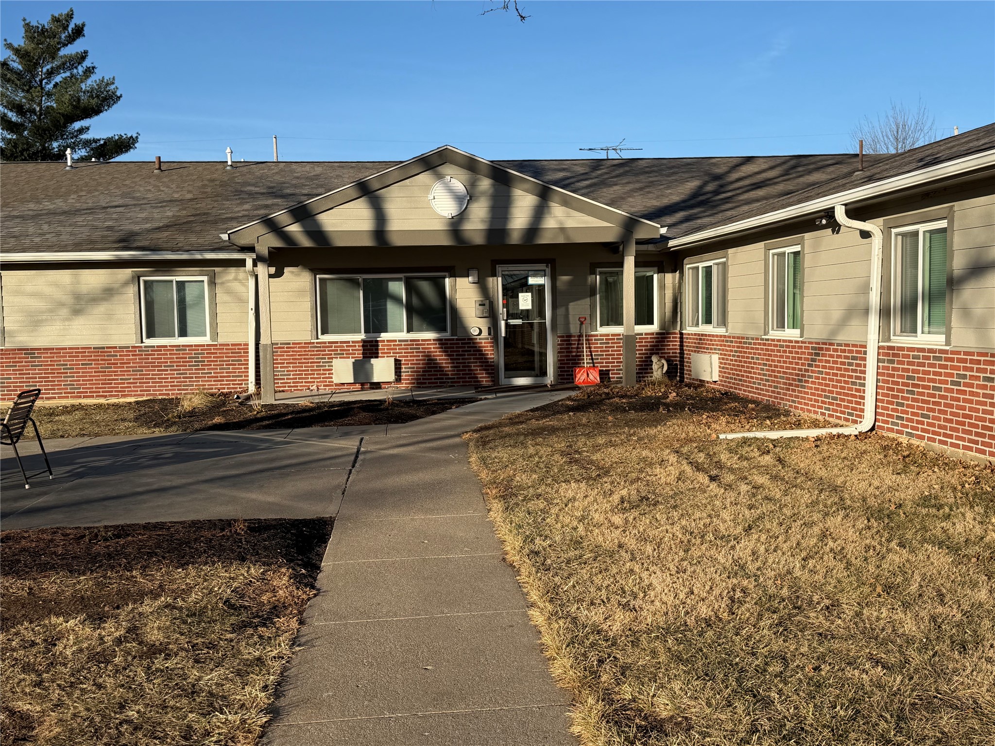 1700 Park Street Beatrice, NE 68310 - Photo 2 of 13 a view of a house with a bed and wooden floor