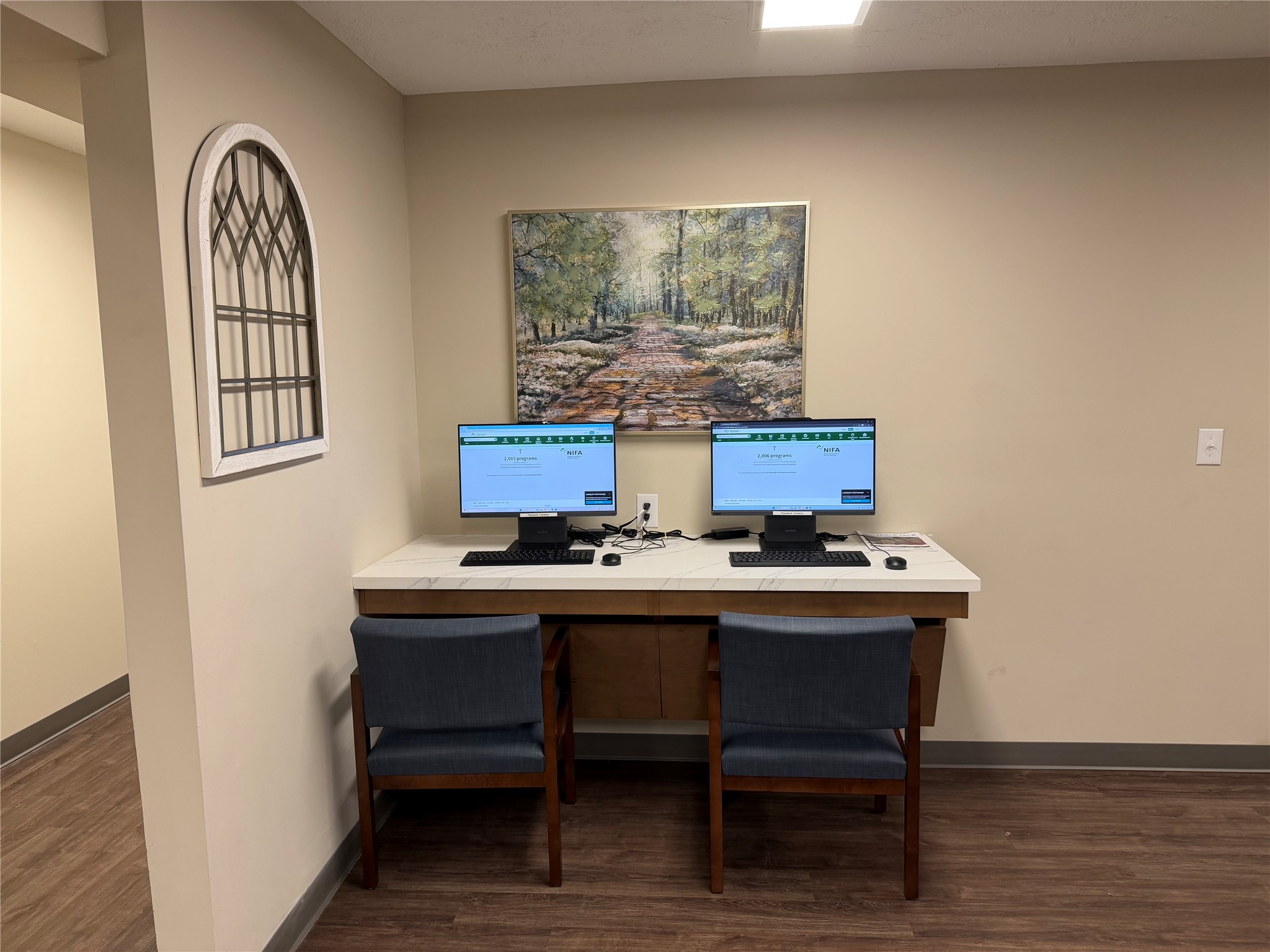 1700 Park Street Beatrice, NE 68310 - Photo 7 of 13 a view of a workspace with furniture and wooden floor