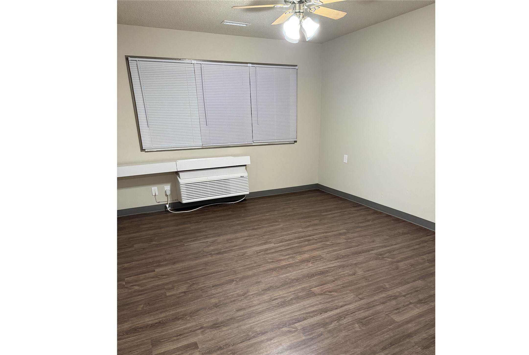 1700 Park Street Beatrice, NE 68310 - Photo 10 of 13 a room with a bench and cabinets
