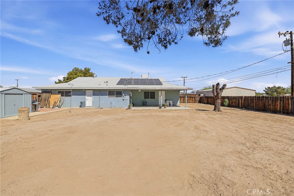 1032 South Farragut Street Ridgecrest, CA 93555 - Photo 20 of 22 a front view of a house with a yard
