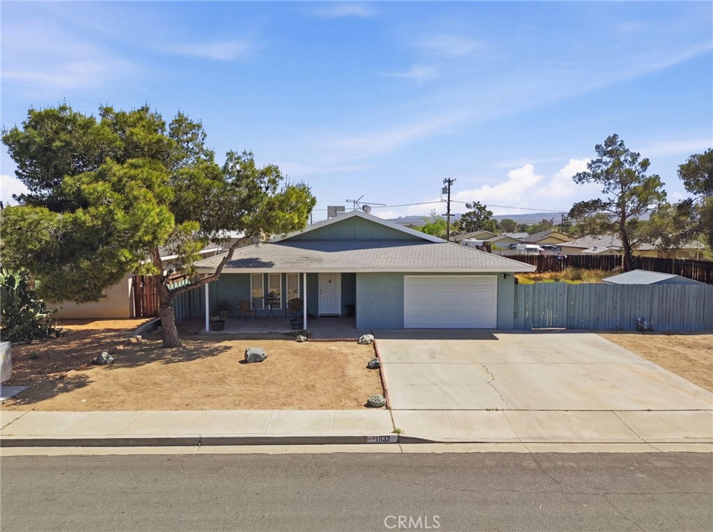 1032 South Farragut Street Ridgecrest, CA 93555 - Photo 2 of 22 a front view of a house with a yard