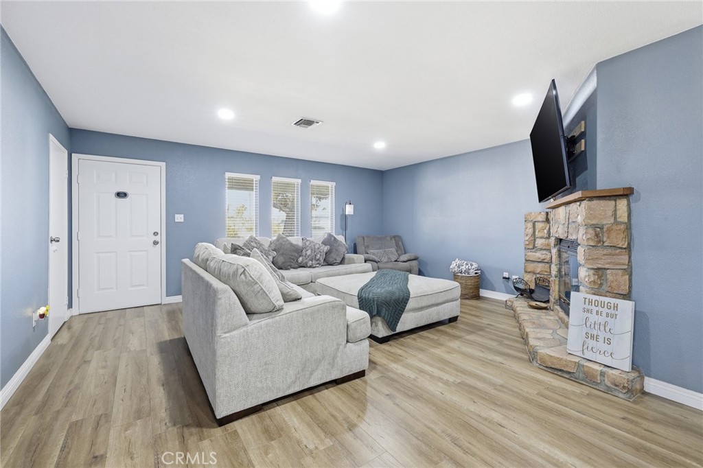 1032 South Farragut Street Ridgecrest, CA 93555 - Photo 7 of 22 a living room with furniture and a flat screen tv
