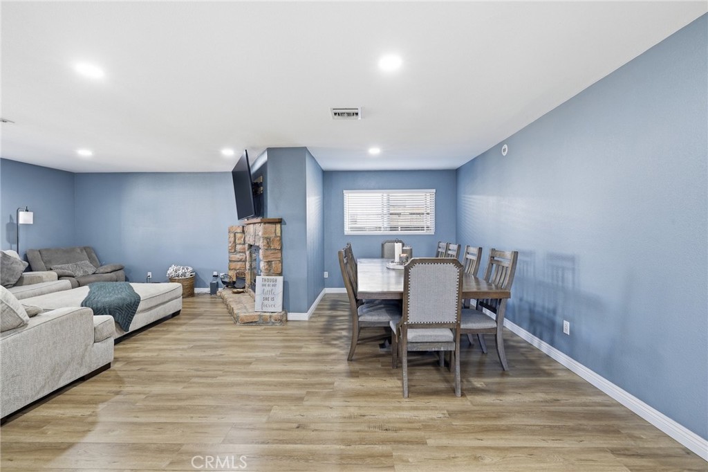 1032 South Farragut Street Ridgecrest, CA 93555 - Photo 8 of 22 a living room with furniture and a wooden floor