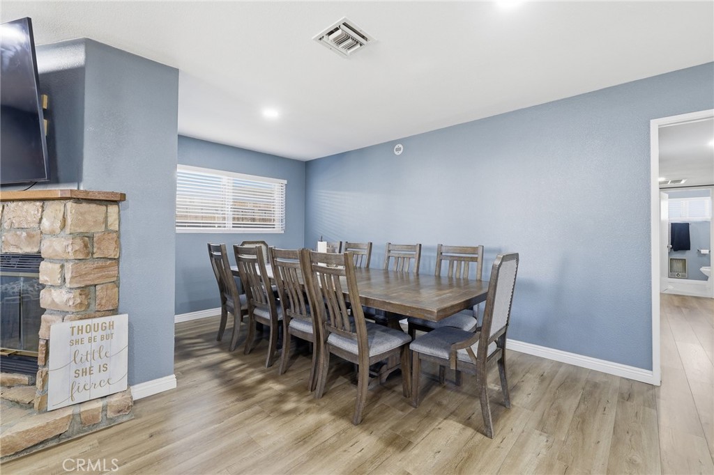 1032 South Farragut Street Ridgecrest, CA 93555 - Photo 9 of 22 a view of a dining room with furniture and wooden floor