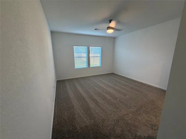 a bathroom with sink shower and mirror