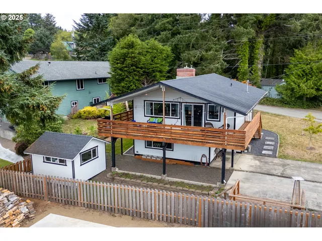 a house view with a outdoor seating and yard
