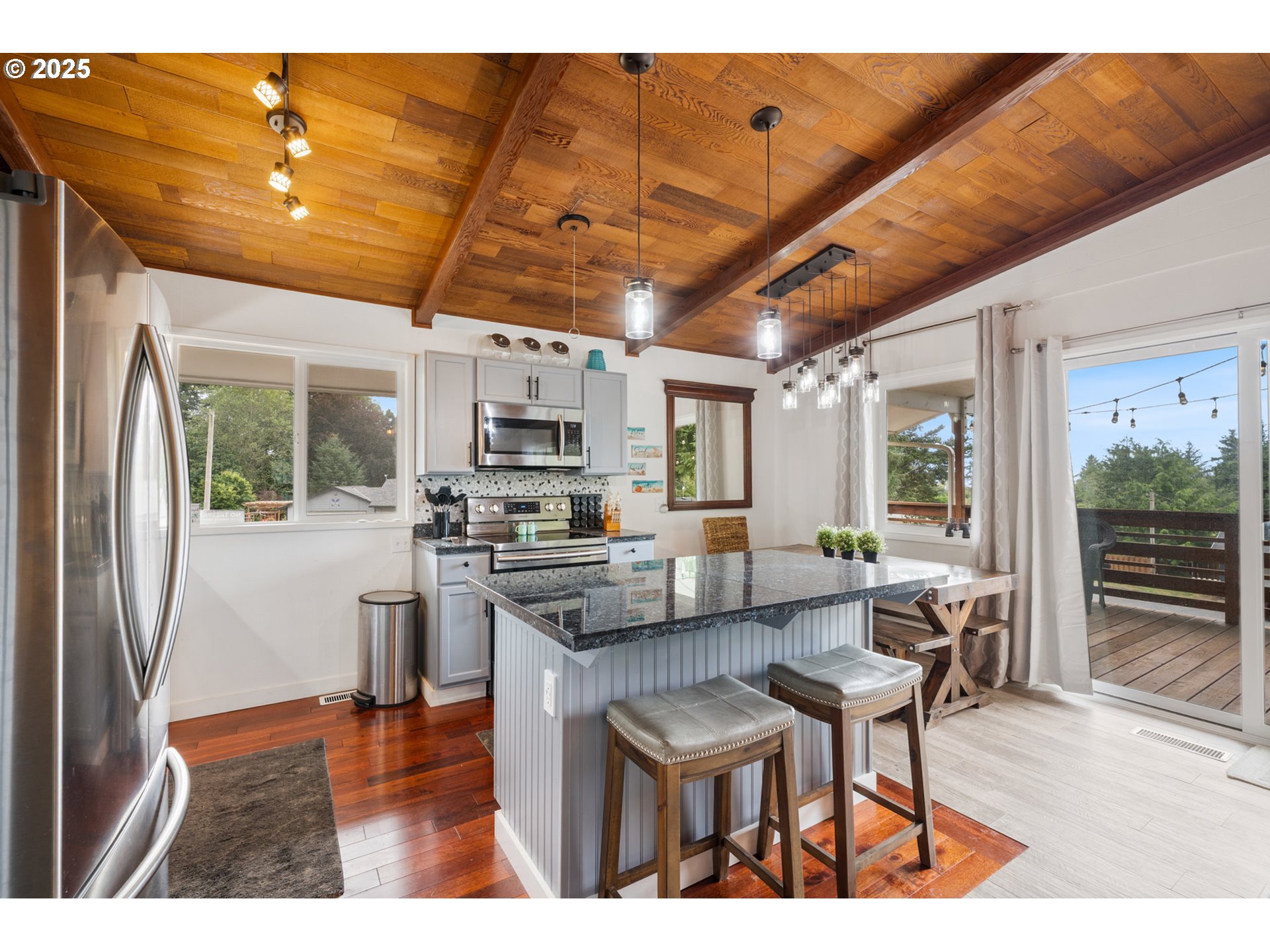 1960 Alder Cove Road West Netarts, OR 97141 - Photo 13 of 41 a living room with stainless steel appliances kitchen island granite countertop furniture and a kitchen view