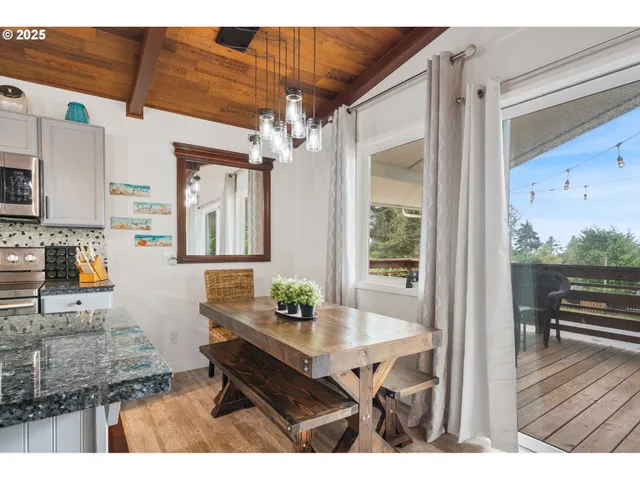 a kitchen view living room and dining room