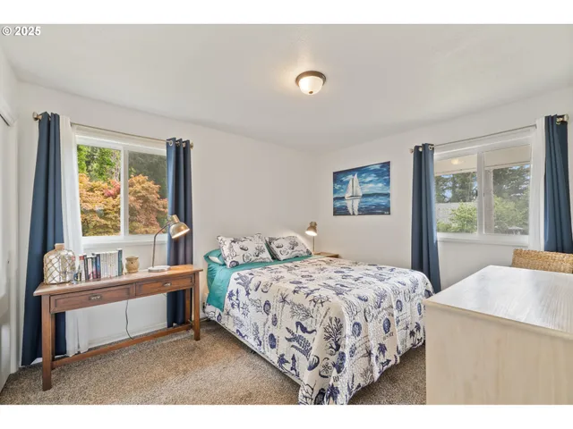 a bedroom with a bed and a couch