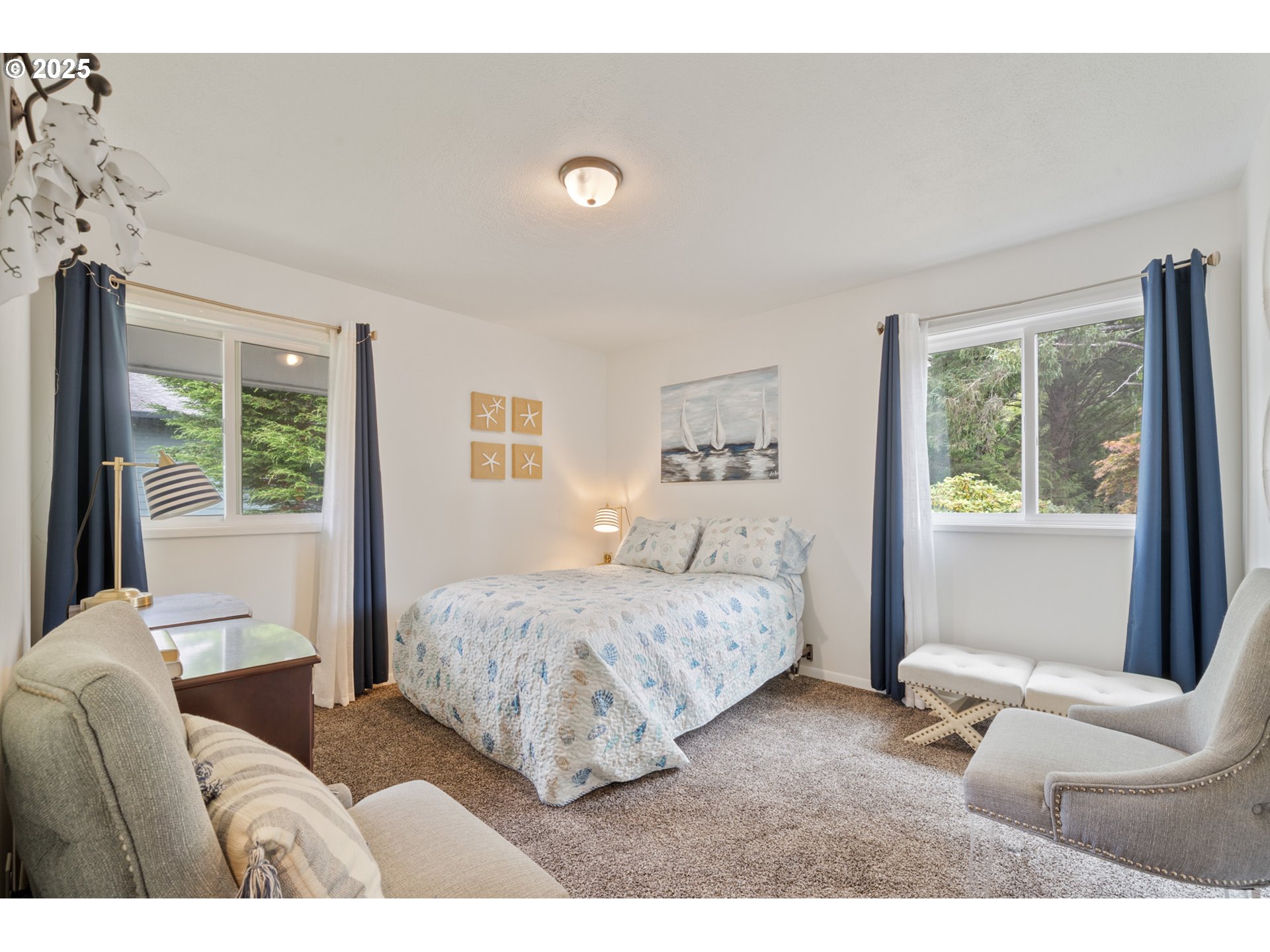 1960 Alder Cove Road West Netarts, OR 97141 - Photo 20 of 41 a bedroom with a bed and a couch