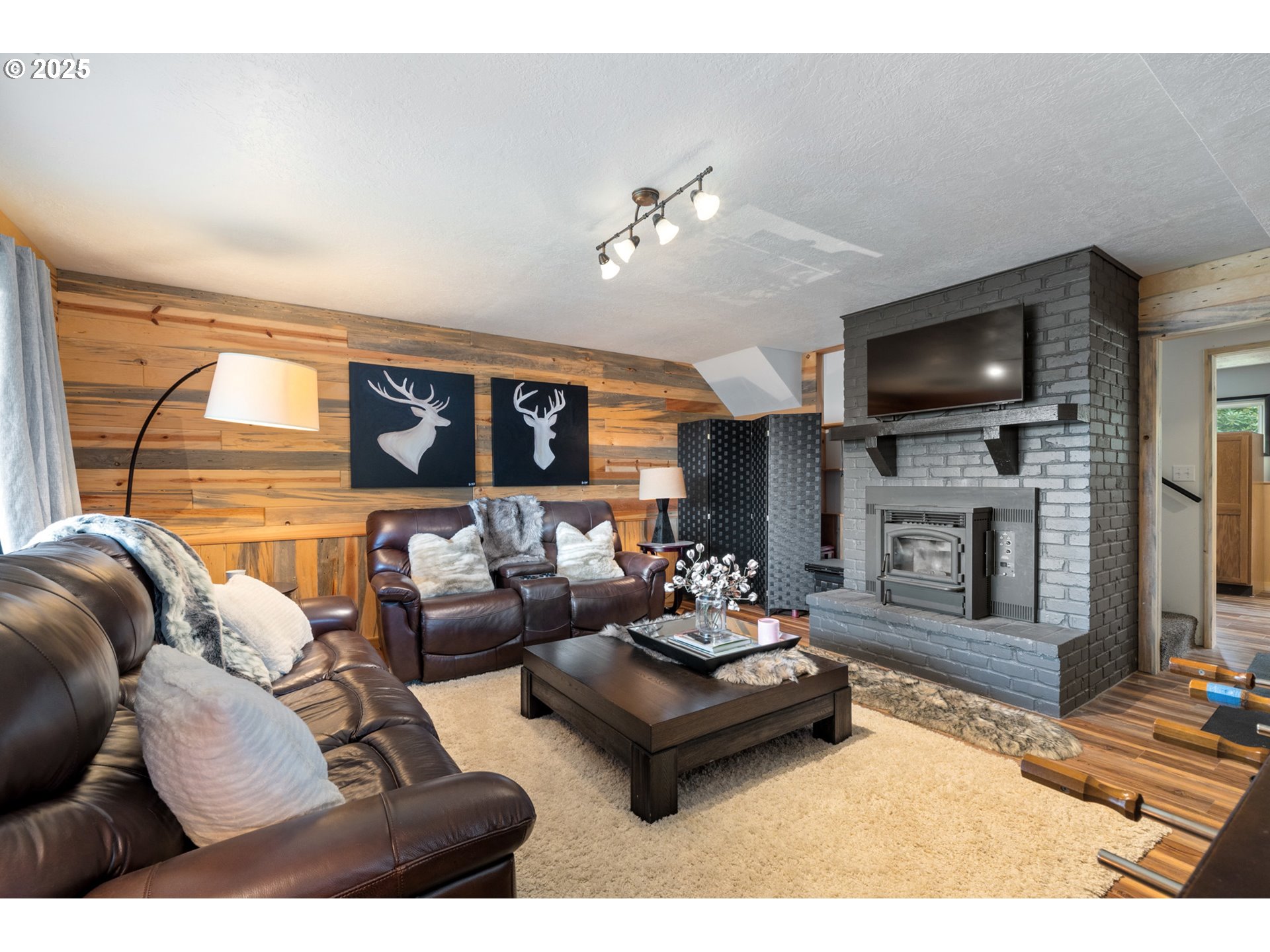 1960 Alder Cove Road West Netarts, OR 97141 - Photo 24 of 41 a living room with fireplace furniture and a flat screen tv