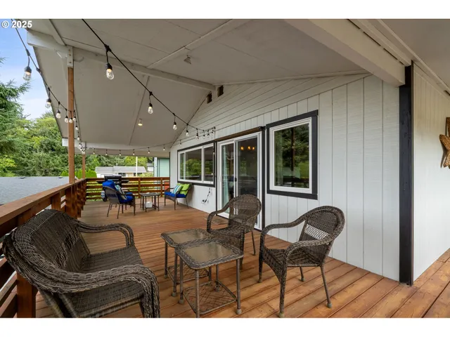 a view of a patio with table and chairs