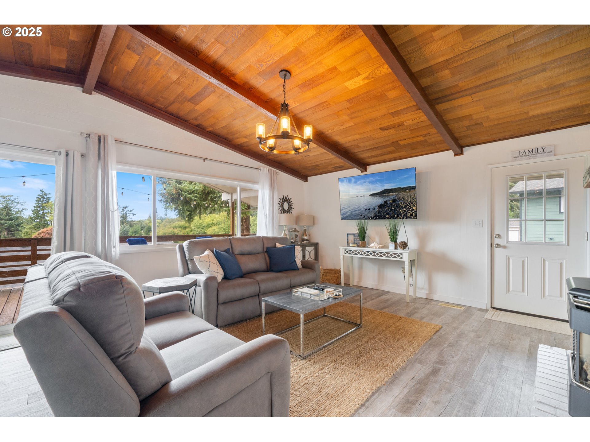 1960 Alder Cove Road West Netarts, OR 97141 - Photo 10 of 41 a living room with furniture a ceiling fan and a window