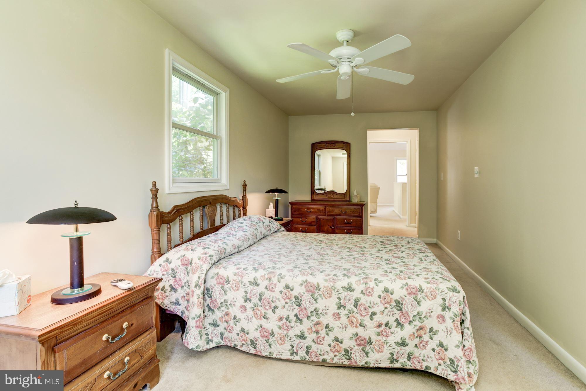 2800 Ridge Road Windsor Mill, MD 21244 - Photo 17 of 37 a bedroom with a bed and a chandelier