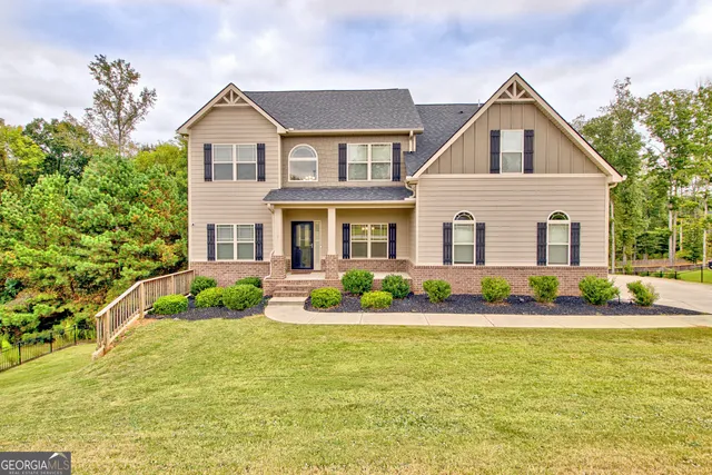 a front view of a house with a yard