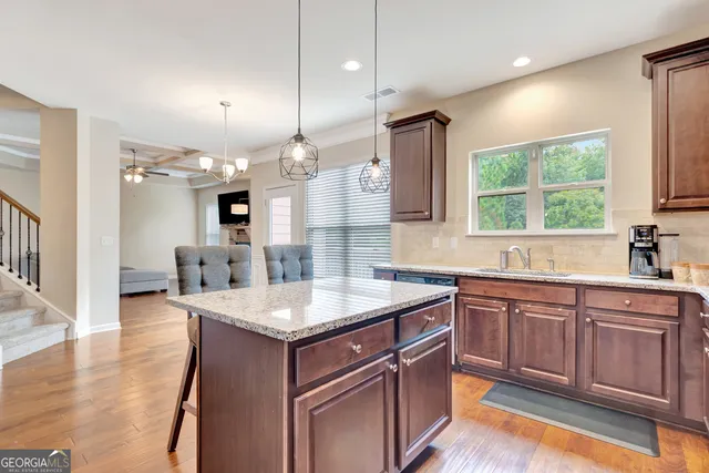 a bathroom with a toilet a sink and curtain