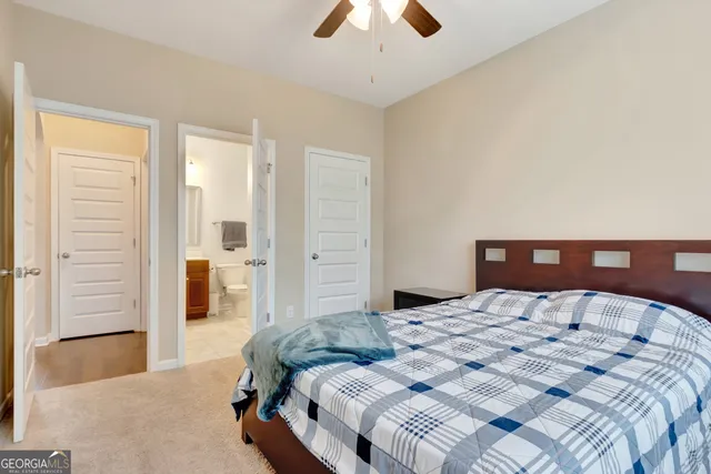 a view of staircase with railing and a rug