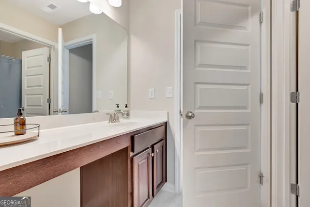 a view of hallway with wooden floor