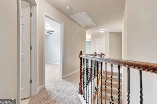 an empty room with a empty space and a ceiling fan