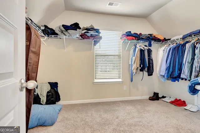 a balcony with wooden floor and fence