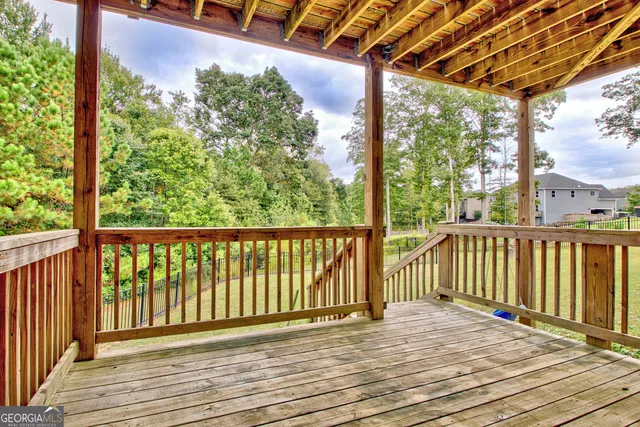 a view of outdoor space with deck and backyard