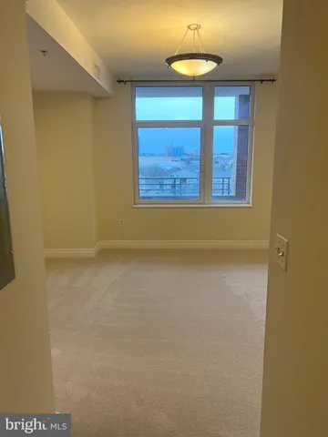 a view of a swimming pool with an outdoor seating