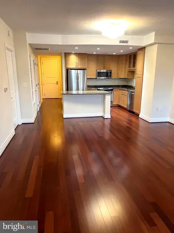 a white toilet sitting next to a bath tub