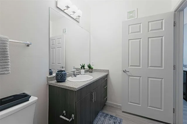 a bathroom with a toilet and a bathtub