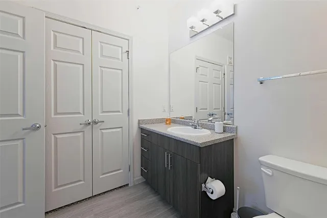 a bathroom with a shower a toilet and a sink