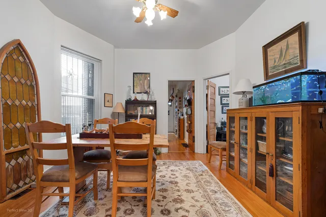 a living room with furniture a rug and a window