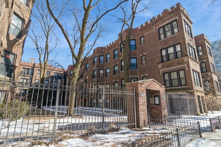 6251 North Sheridan Road, Unit 8 Chicago, IL 60660 - Photo 1 of 11 a view of a brick building next to a road