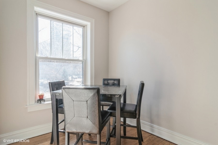 6251 North Sheridan Road, Unit 8 Chicago, IL 60660 - Photo 6 of 11 a dining room with furniture and window