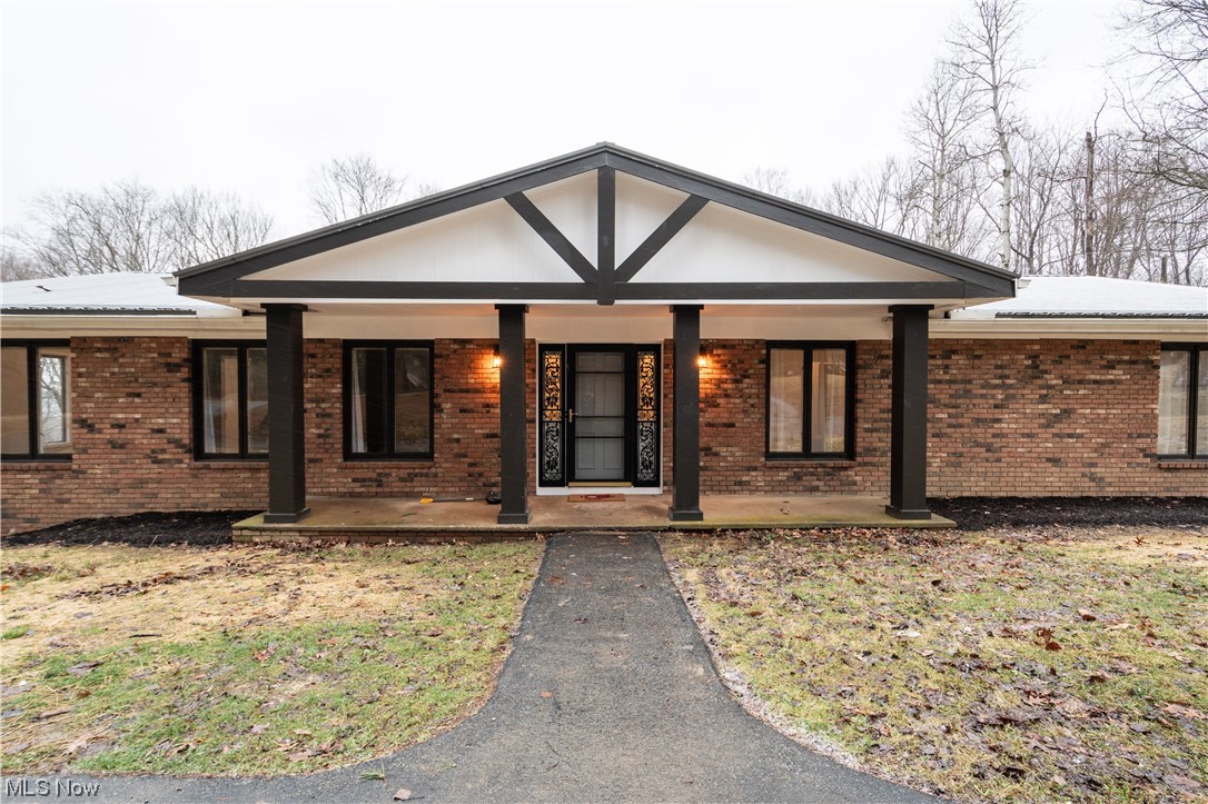9980 Chardon Road Chardon, OH 44024 - Photo 1 of 46 Ranch-style house with a porch