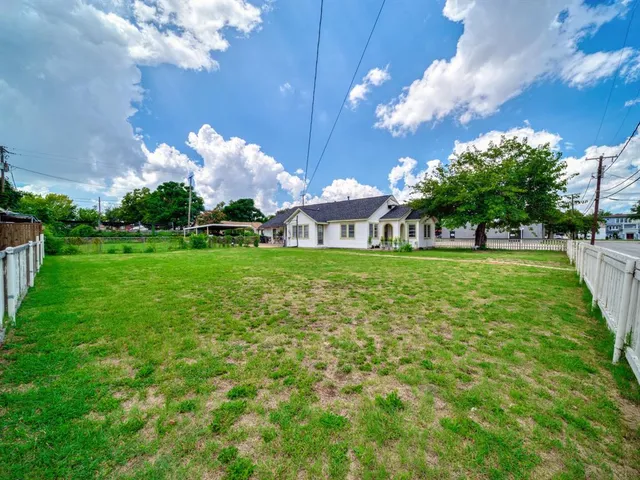 a view of a building with a big yard