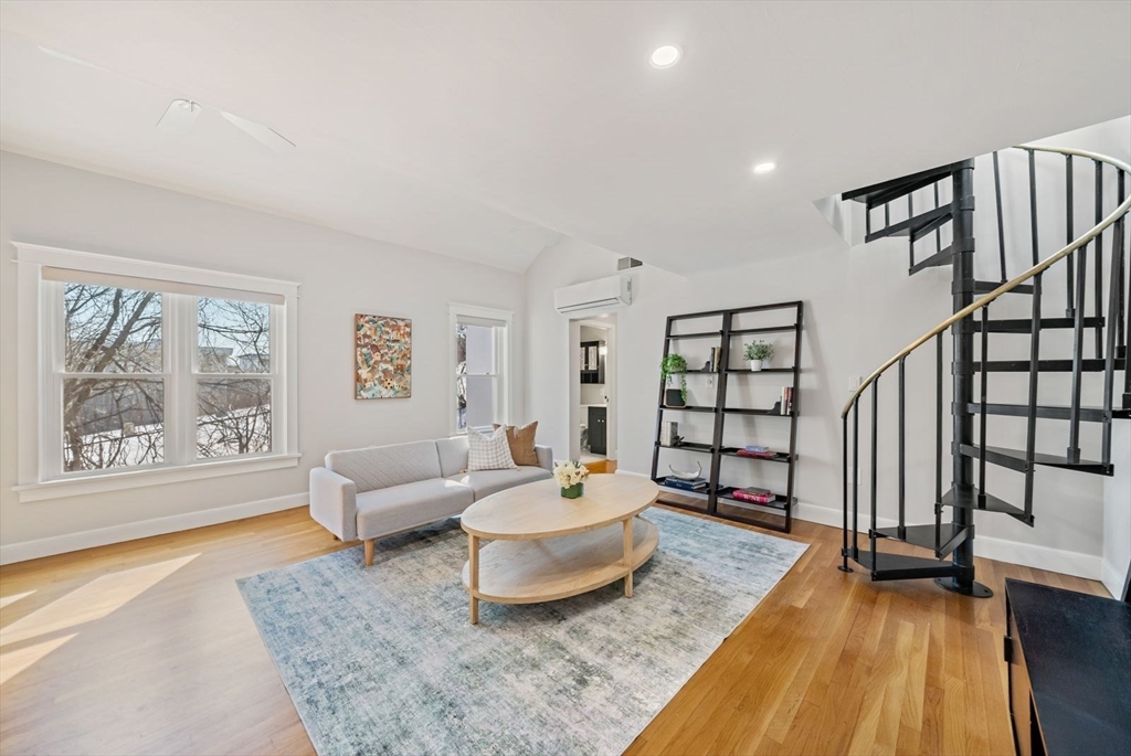 53 North Mead Street, Unit C10 Boston, MA 02129 - Photo 1 of 15 a living room with furniture and wooden floor
