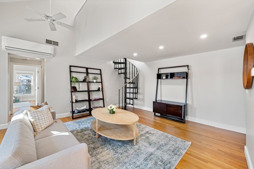 53 North Mead Street, Unit C10 Boston, MA 02129 - Photo 6 of 15 a living room with furniture and a wooden floor