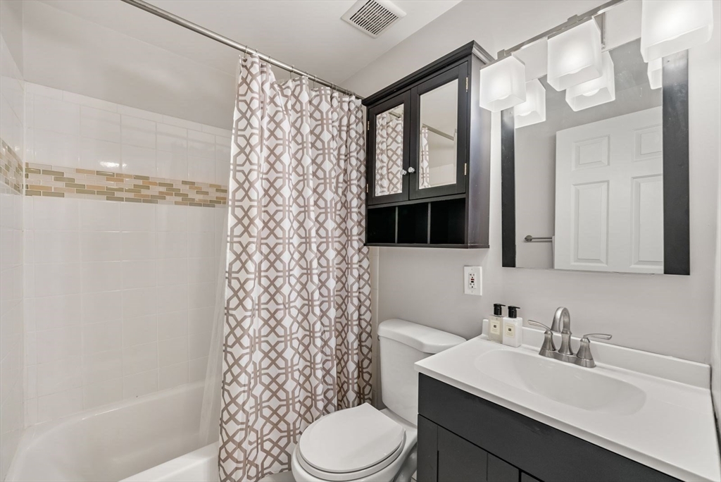 53 North Mead Street, Unit C10 Boston, MA 02129 - Photo 8 of 15 a bathroom with a sink toilet and shower