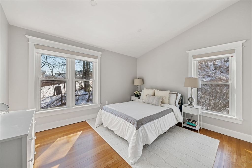 53 North Mead Street, Unit C10 Boston, MA 02129 - Photo 9 of 15 a bedroom with a large bed and a window