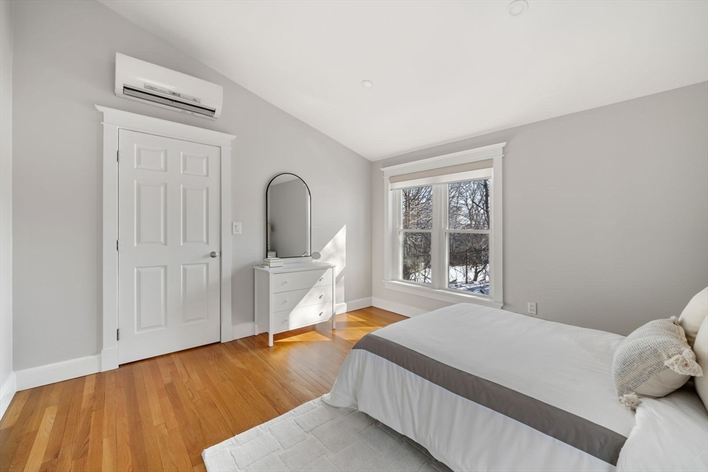 53 North Mead Street, Unit C10 Boston, MA 02129 - Photo 10 of 15 a bedroom with a bed and a window