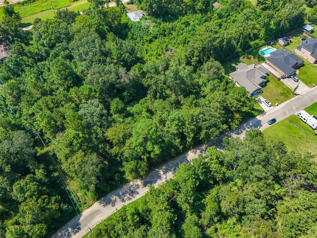 Tbd Lot 16 Tbd Lane Splendora, TX 77372 - Photo 4 of 10 an aerial view of residential house with outdoor space and trees all around
