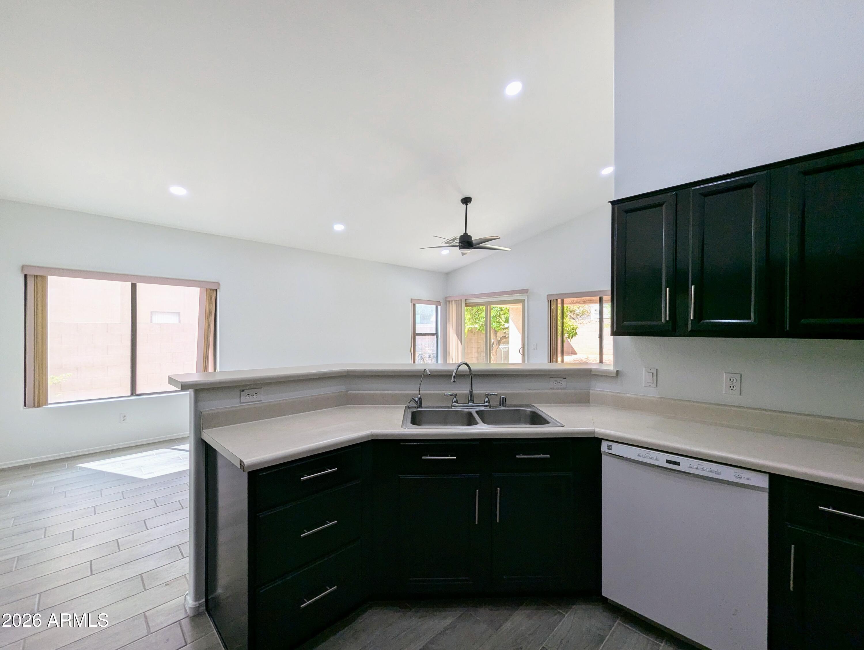 5424 West Wagoner Road Glendale, AZ 85308 - Photo 14 of 37 a kitchen with a sink cabinets and window