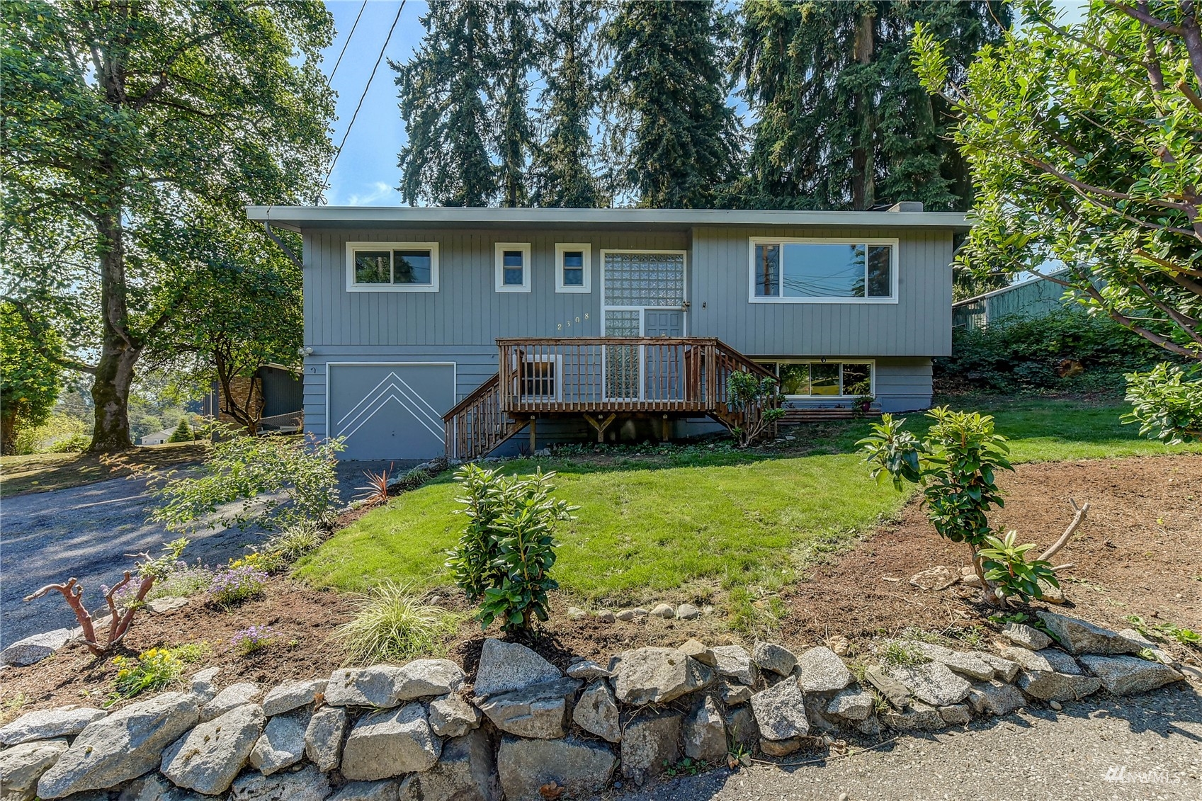 2308 228th Street Southwest Bothell, WA 98021 - Photo 1 of 1 a view of a house with a yard and a garden