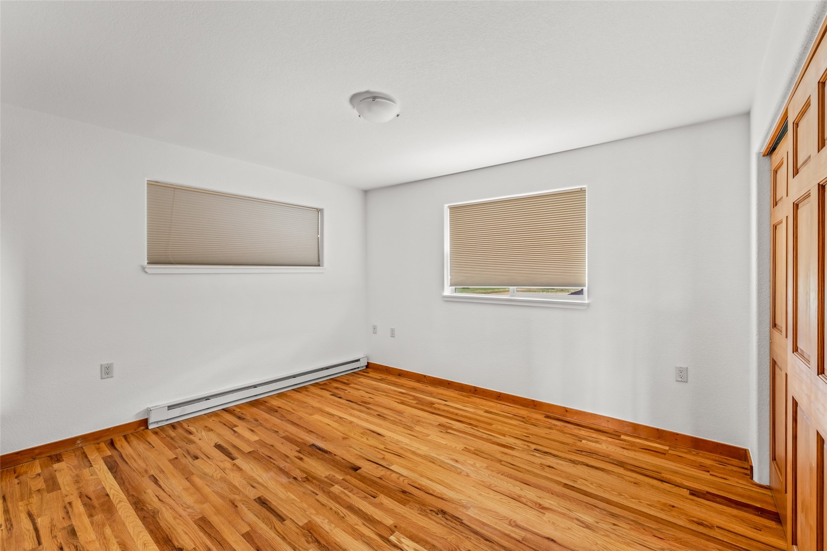 127 Oak Ridge Circle, Unit 104 Oak Creek, CO 80467 - Photo 16 of 26 a view of empty room with wooden floor